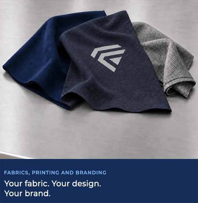 Fabric options for custom apparel laid out on a table