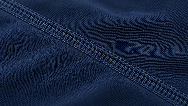 Close-up of flatlock stitching on a Fabrion rashguard