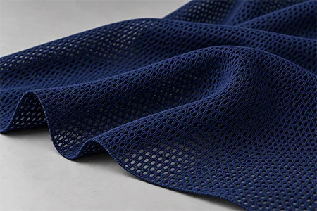 Polyester mesh fabric swatch for rashguard side panels from Fabrion