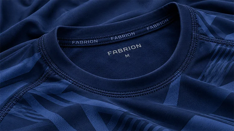 Sublimation-printed Fabrion rashguard neckline with custom neck tape and a heat-pressed neck label